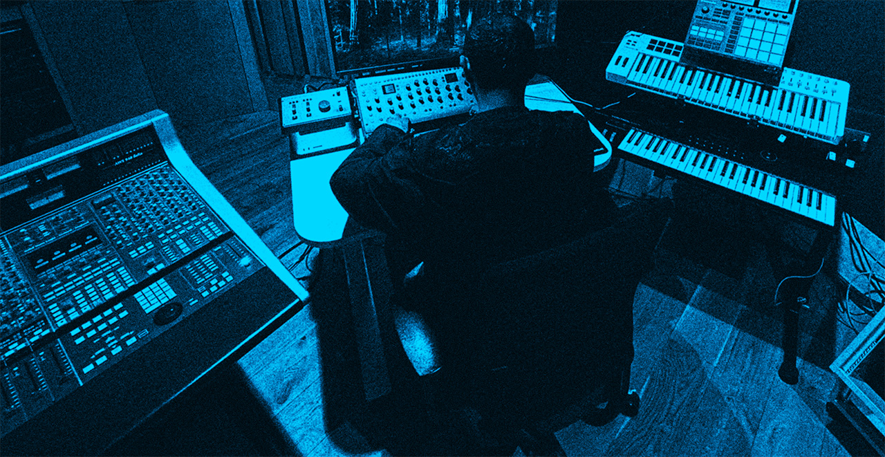 An image with a broad, high-angle view of Jason working in the studio.